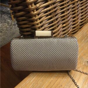 Silver clutch/cross-body purse.